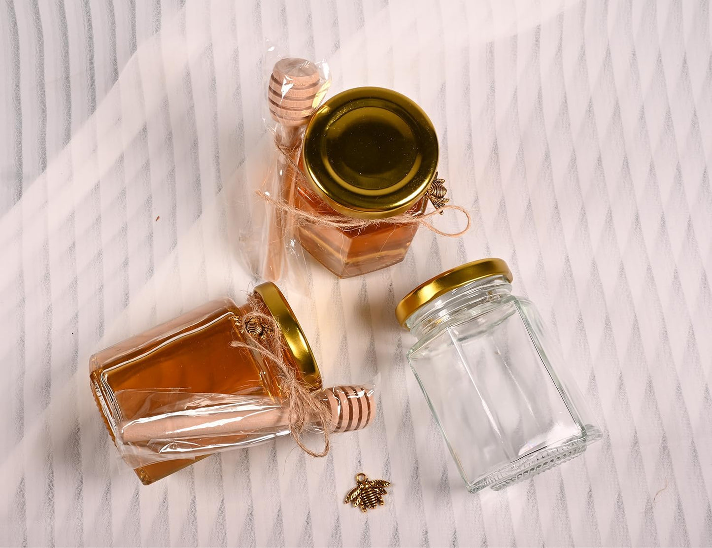 Adabocute 4oz Hexagonal Honey Jars - Glass Honey Jars with Gold Lids, Wooden Dippers, Bee Charms and Jutes - Hexagon Jars for Baby Shower, Wedding and Party Favors, 12 Pack