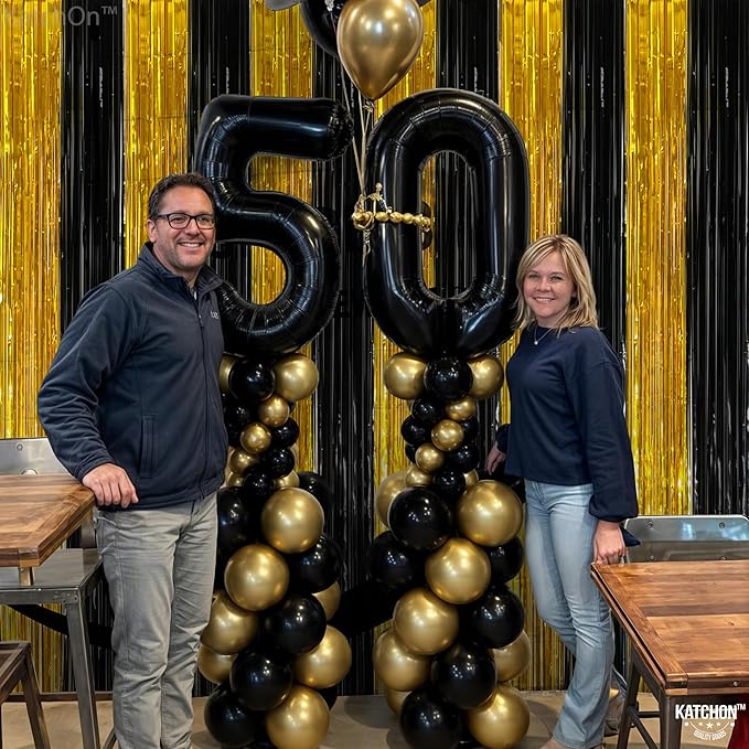 KatchOn, Xtralarge Black and Gold Streamers - 8x3.2 Feet, Pack of 2 | Black and Gold Fringe Curtain for Black and Gold Party Decorations | Black and Gold Backdrop, Graduation Decorations 2024